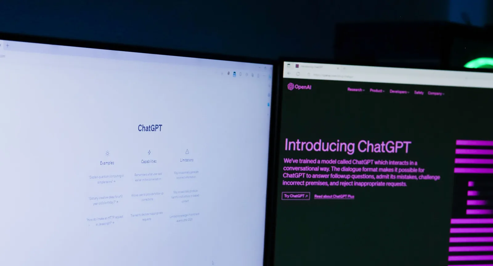 Two monitors showing AI chat tools and the OpenAI ChatGPT introduction page, illustrating business use of artificial intelligence